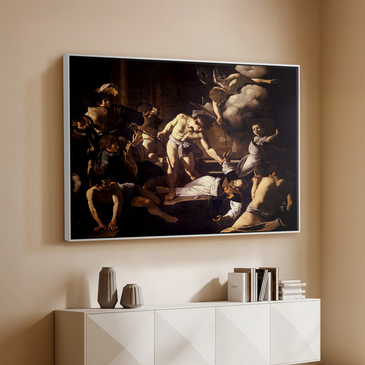 White floater framed canvas of The Martyrdom of Saint Matthew, 1599-1600 by Caravaggio, featuring a dramatic moment of martyrdom with figures reacting in panic above a console cabinet in a minimalist entryway.