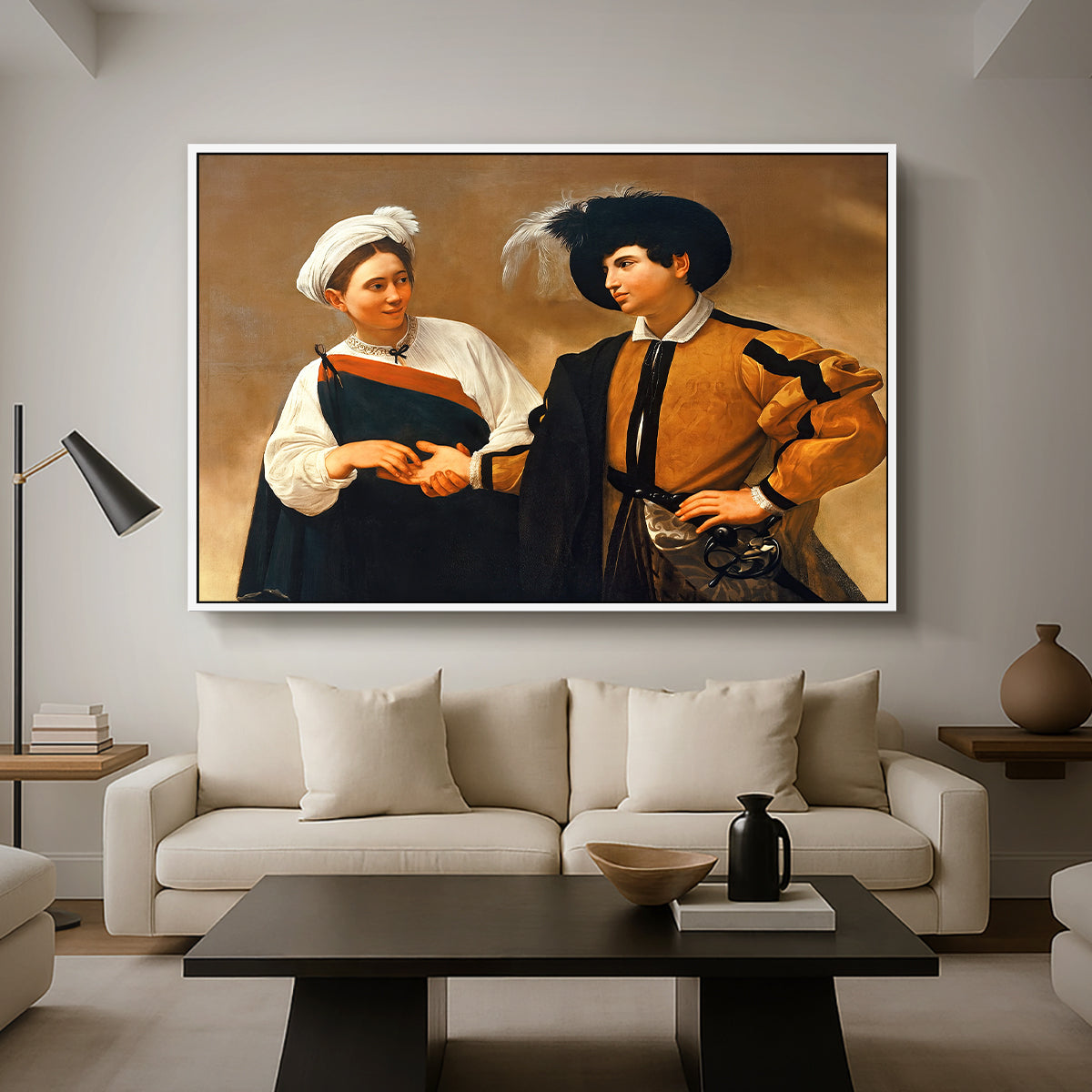 The Fortune Teller (Capitoline Version), c. 1599 by Caravaggio as a white floater framed canvas featuring a woman reading man's palm while discreetly removing his ring, displayed above a sofa in a modern living room.