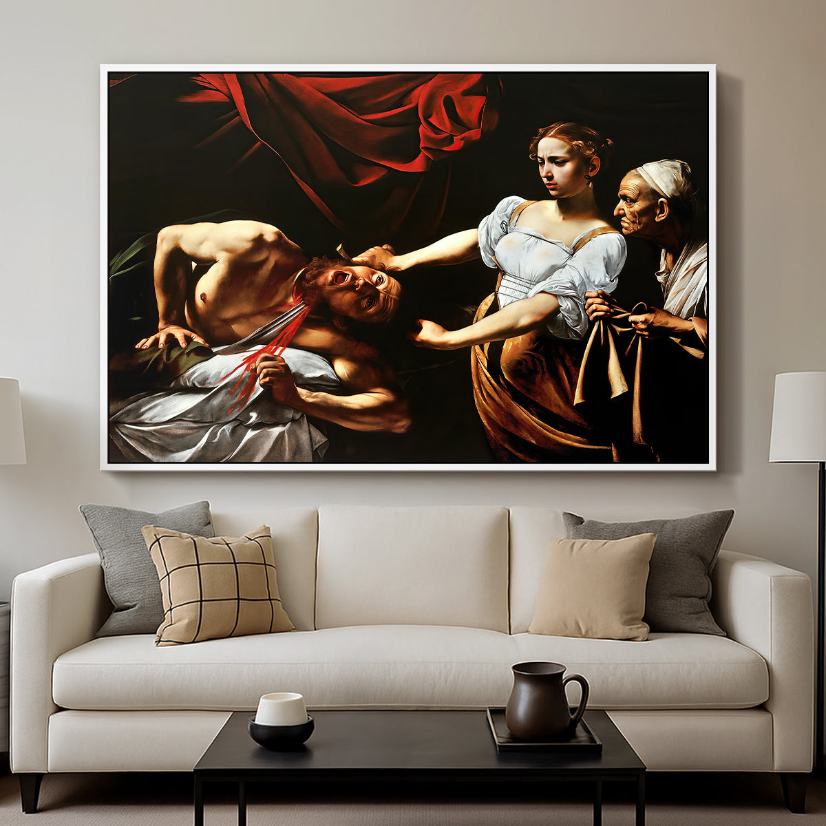 Judith Beheading Holofernes, c. 1599 by Caravaggio displayed in a white floater framed canvas above a sofa in a clean living room.