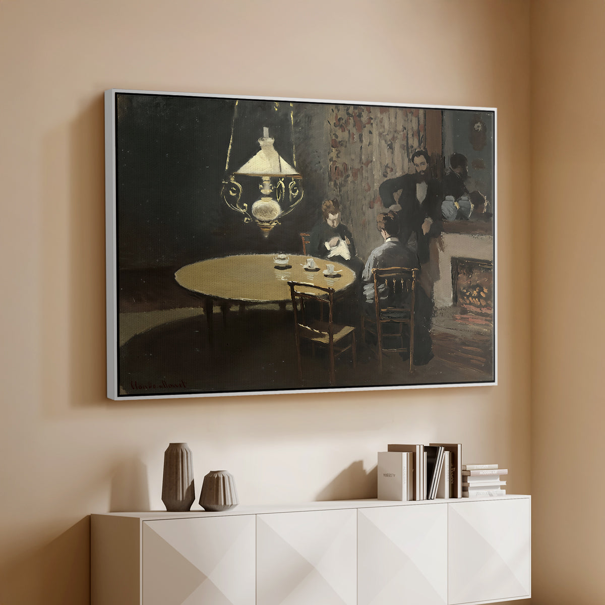 White floater framed canvas of Interior, after Dinner, 1868-1869 by Claude Monet, featuring a quiet domestic scene with lamp-lit table and subdued atmosphere above a console cabinet in a minimalist entryway.