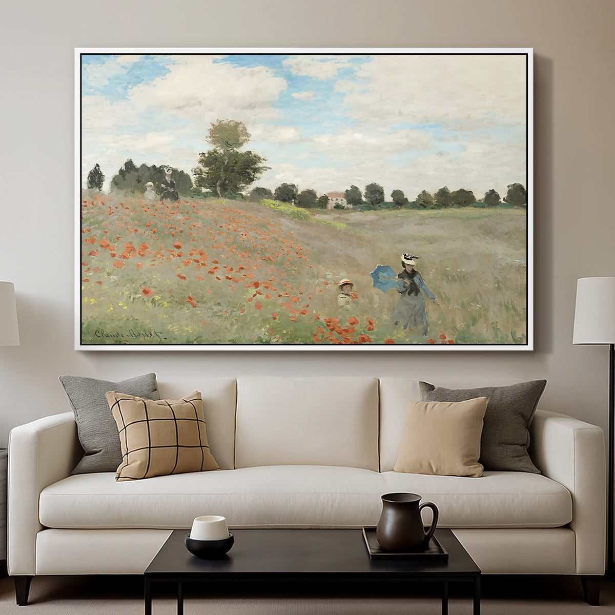 The Poppy Field near Argenteuil, 1873 by Claude Monet displayed in a white floater framed canvas above a sofa in a clean living room.