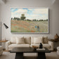 The Poppy Field near Argenteuil, 1873 by Claude Monet as a white floater framed canvas featuring a field of red poppies with figures walking across rolling landscape, displayed above a sofa in a modern living room.