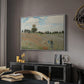 The Poppy Field near Argenteuil, 1873 by Claude Monet in a white floater framed canvas featuring a bright meadow filled with poppies under open sky, displayed above a desk in a dark home office interior.