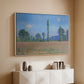 White floater framed canvas of Poppy Field (Giverny), 1890-1891 by Claude Monet, featuring an impressionist landscape of blooming poppies in countryside above a console cabinet in a minimalist entryway.