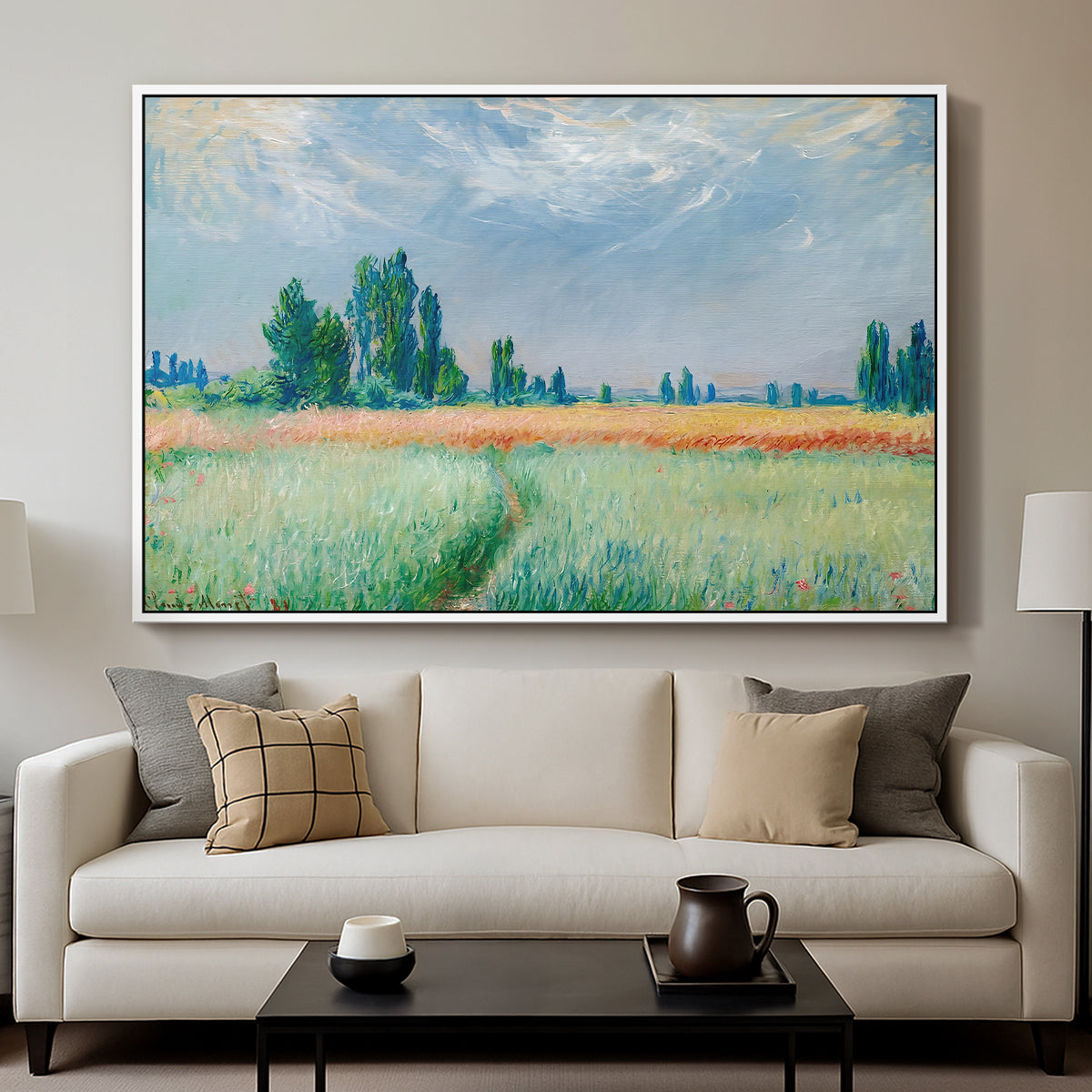 The Wheat Field (Champ de Blé), 1881 by Claude Monet displayed in a white floater framed canvas above a sofa in a clean living room.