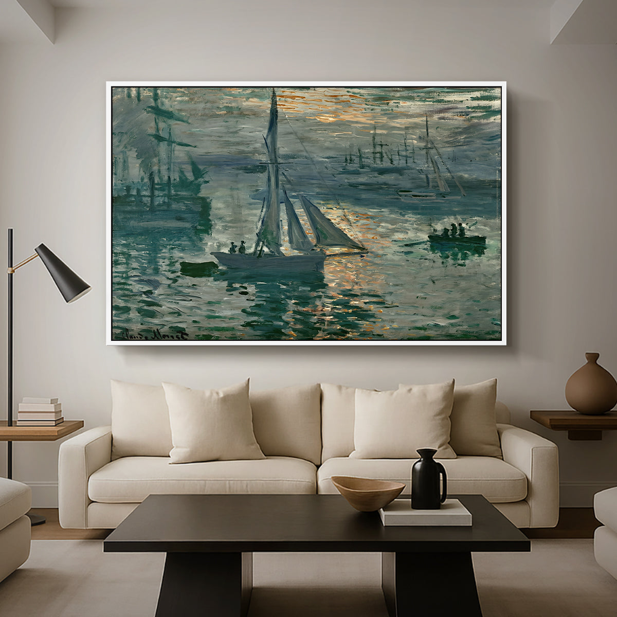 Sunrise (Marine), 1873 by Claude Monet as a white floater framed canvas featuring a hazy sunrise over harbor with boats silhouetted in soft morning light, displayed above a sofa in a modern living room.