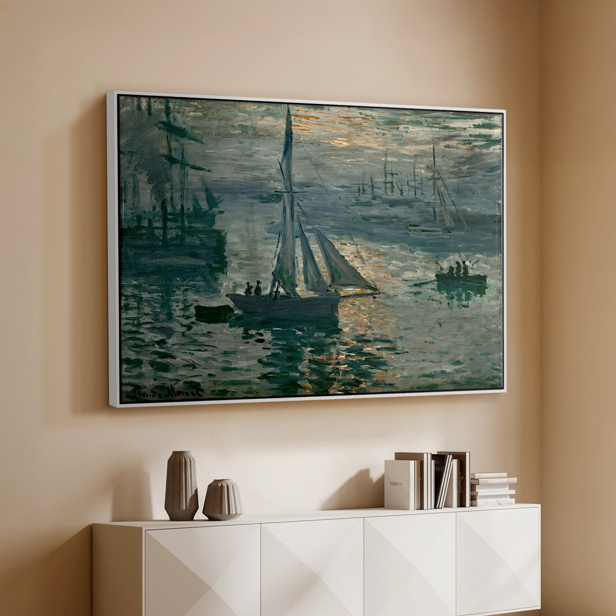 White floater framed canvas of Sunrise (Marine), 1873 by Claude Monet, featuring an impressionist seascape with glowing sun and misty water above a console cabinet in a minimalist entryway.