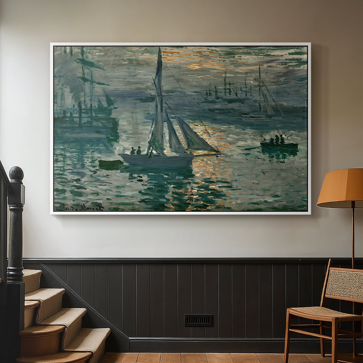 White floater framed canvas featuring an atmospheric ocean view with sun rising through haze, displayed in a hallway near a staircase.