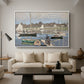 The Basin at Argenteuil, 1874 by Claude Monet as a white floater framed canvas featuring sailboats gathered in calm basin with reflections on water, displayed above a sofa in a modern living room.