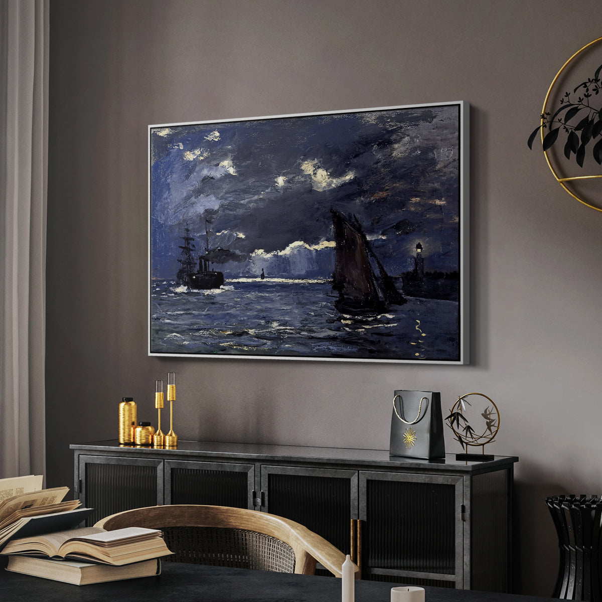 A Seascape, Shipping by Moonlight, 1864 by Claude Monet in a white floater framed canvas featuring a dramatic ocean scene with light reflecting across water at night, displayed above a desk in a dark home office interior.
