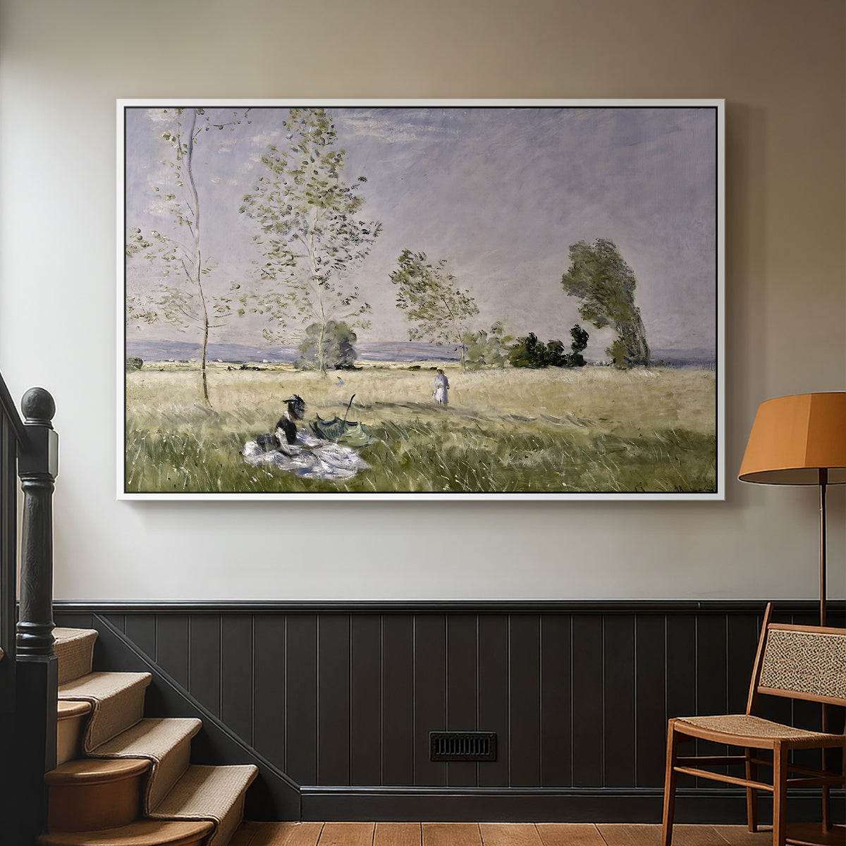 White floater framed canvas featuring a tranquil summer landscape with lone figure in nature, displayed in a hallway near a staircase.