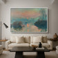 Sunset on the Seine at Lavacourt, Winter Effect, 1880 by Claude Monet as a white floater framed canvas featuring a glowing sunset over snowy river landscape with soft reflections, displayed above a sofa in a modern living room.