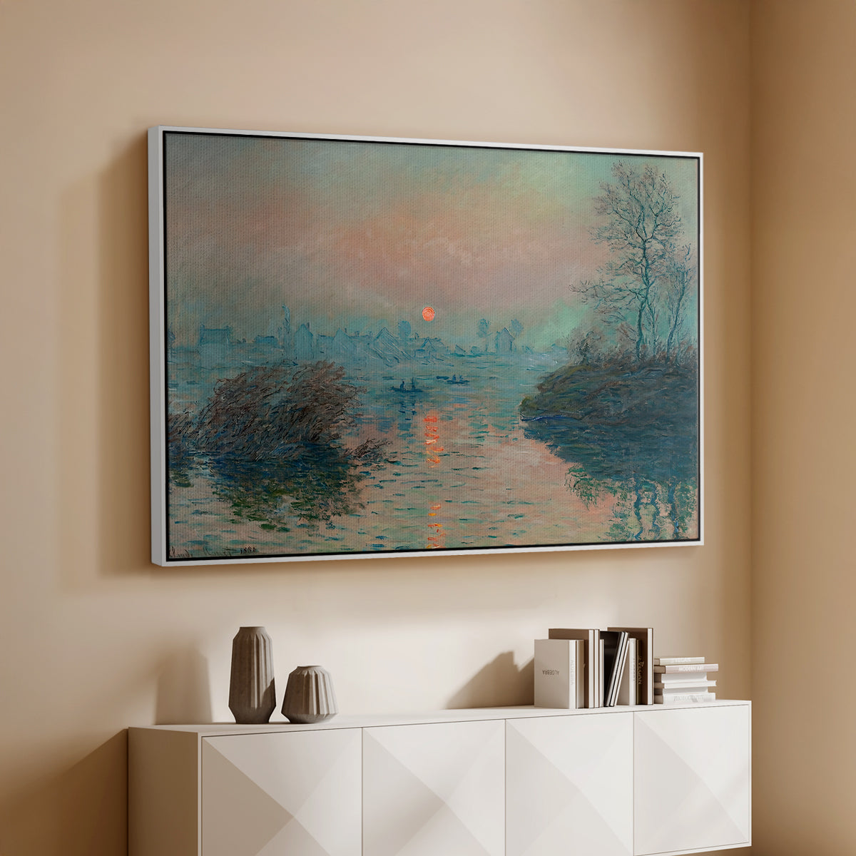 White floater framed canvas of Sunset on the Seine at Lavacourt, Winter Effect, 1880 by Claude Monet, featuring a winter scene with warm light reflecting on water at dusk above a console cabinet in a minimalist entryway.