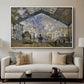 The Gare Saint-Lazare, 1877 by Claude Monet displayed in a white floater framed canvas above a sofa in a clean living room.