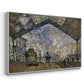Angled view of The Gare Saint-Lazare, 1877 by Claude Monet in a white floater framed canvas.
