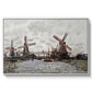 Windmills near Zaandam, 1871 by Claude Monet in a white floater framed canvas wall art display.