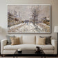 The Boulevard de Pontoise at Argenteuil, Snow Effect, 1875 by Claude Monet displayed in a white floater framed canvas above a sofa in a clean living room.