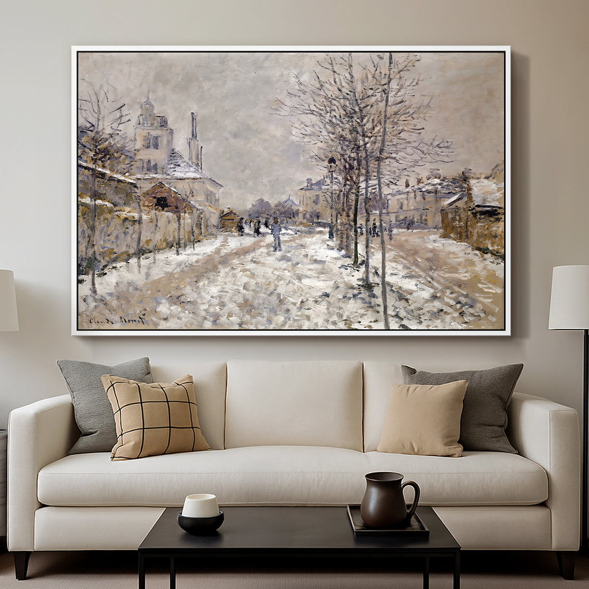 The Boulevard de Pontoise at Argenteuil, Snow Effect, 1875 by Claude Monet displayed in a white floater framed canvas above a sofa in a clean living room.