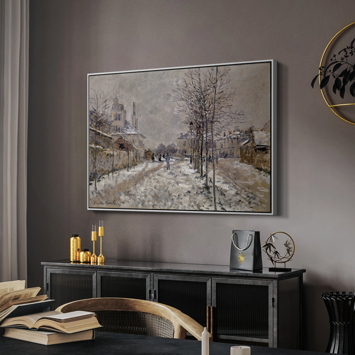 The Boulevard de Pontoise at Argenteuil, Snow Effect, 1875 by Claude Monet in a white floater framed canvas featuring a quiet boulevard blanketed in snow with distant figures, displayed above a desk in a dark home office interior.