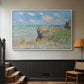 White floater framed canvas featuring an elevated shoreline path with figures and bright sky, displayed in a hallway near a staircase.