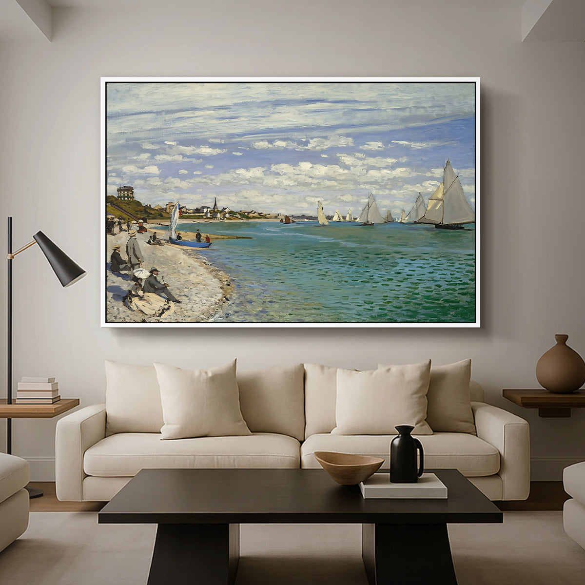 Regatta at Sainte-Adresse, 1867 by Claude Monet as a white floater framed canvas featuring sailboats gathered near shore with flags and spectators along coastline, displayed above a sofa in a modern living room.