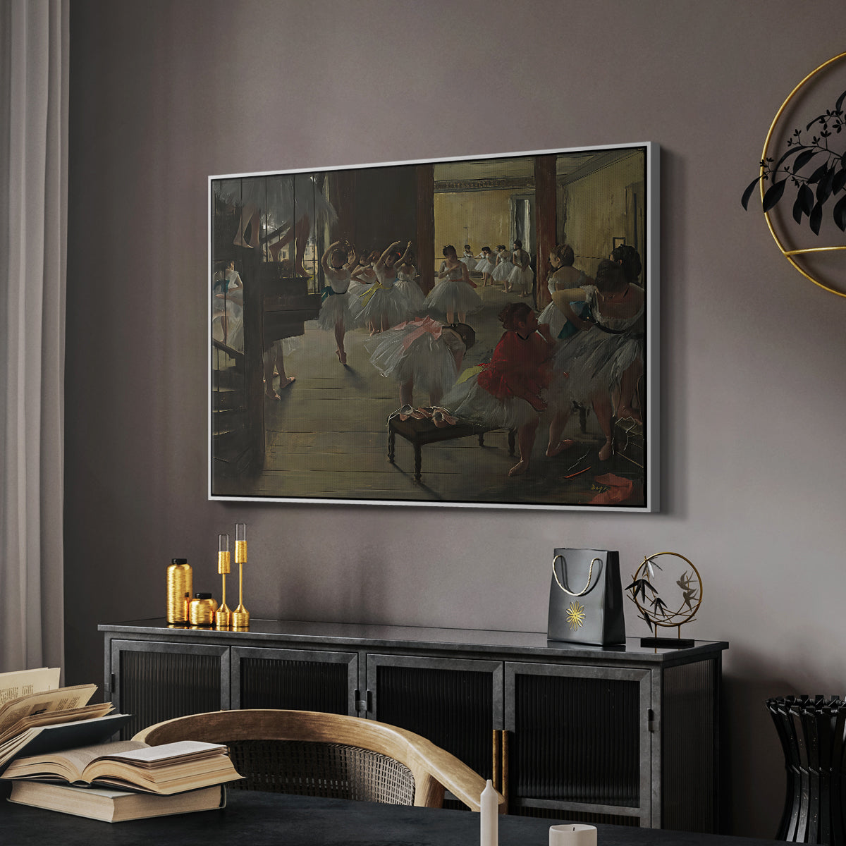 The Dance Class, c. 1873 by Edgar Degas in a white floater framed canvas featuring an impressionist studio interior filled with ballet students, displayed above a desk in a dark home office interior.