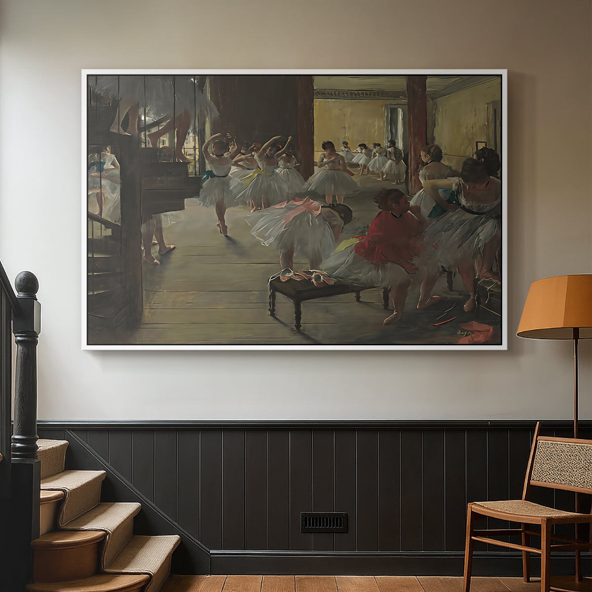 White floater framed canvas featuring a group of dancers preparing during class with natural light, displayed in a hallway near a staircase.