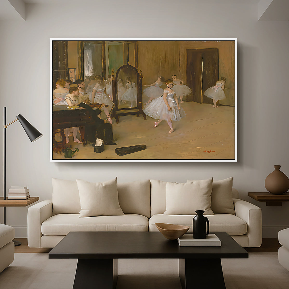 The Dancing Class, c. 1870 by Edgar Degas as a white floater framed canvas featuring a ballet class with dancers practicing positions under instructor guidance, displayed above a sofa in a modern living room.