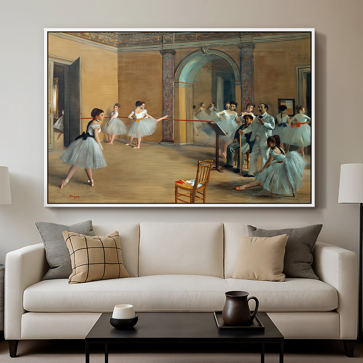 The Dance Foyer at the Opera on the Rue Le Peletier, 1872 by Edgar Degas displayed in a white floater framed canvas above a sofa in a clean living room.