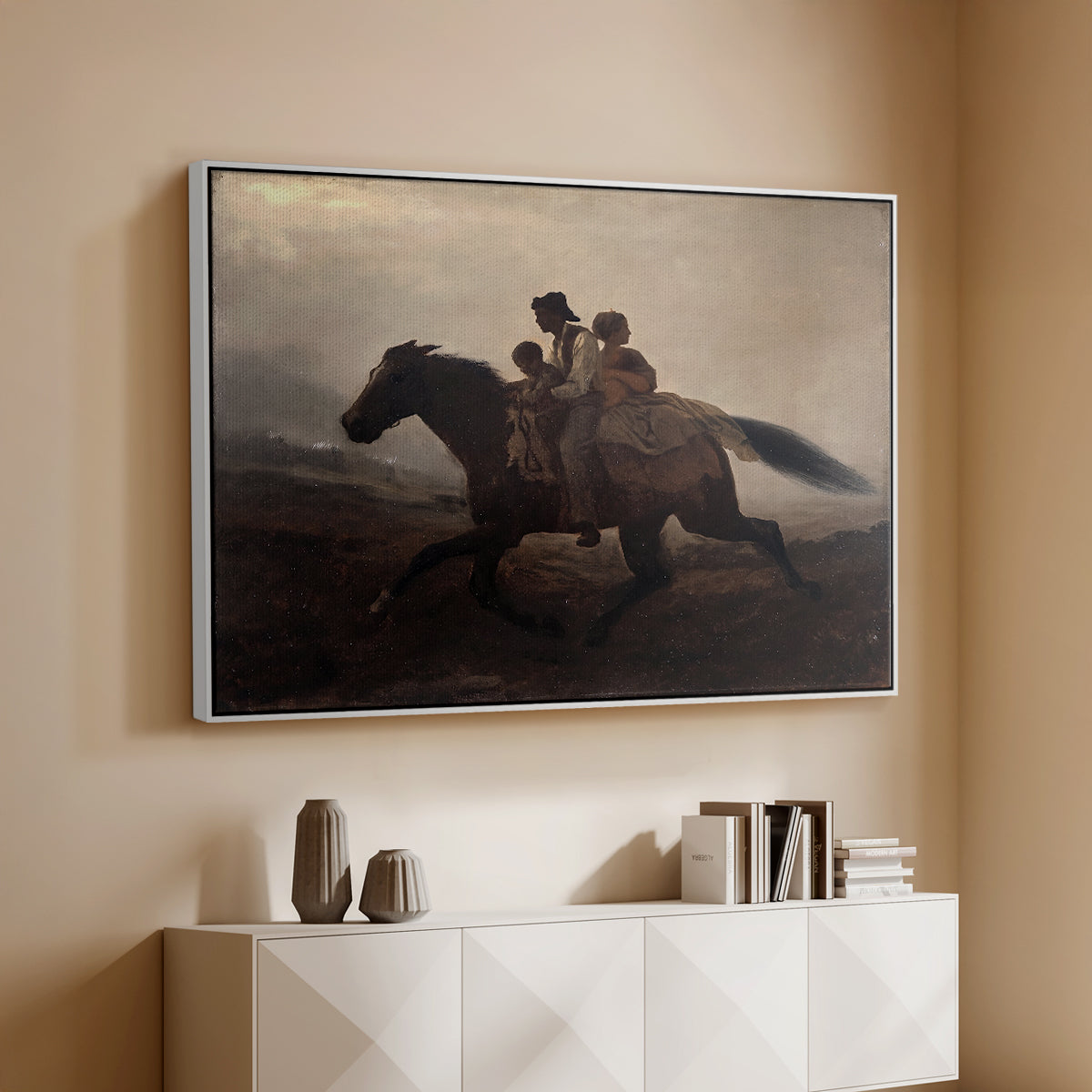 White floater framed canvas of A Ride for Liberty – The Fugitive Slaves, c. 1862 by Eastman Johnson, featuring a dramatic scene of enslaved people fleeing on horseback in darkness above a console cabinet in a minimalist entryway.