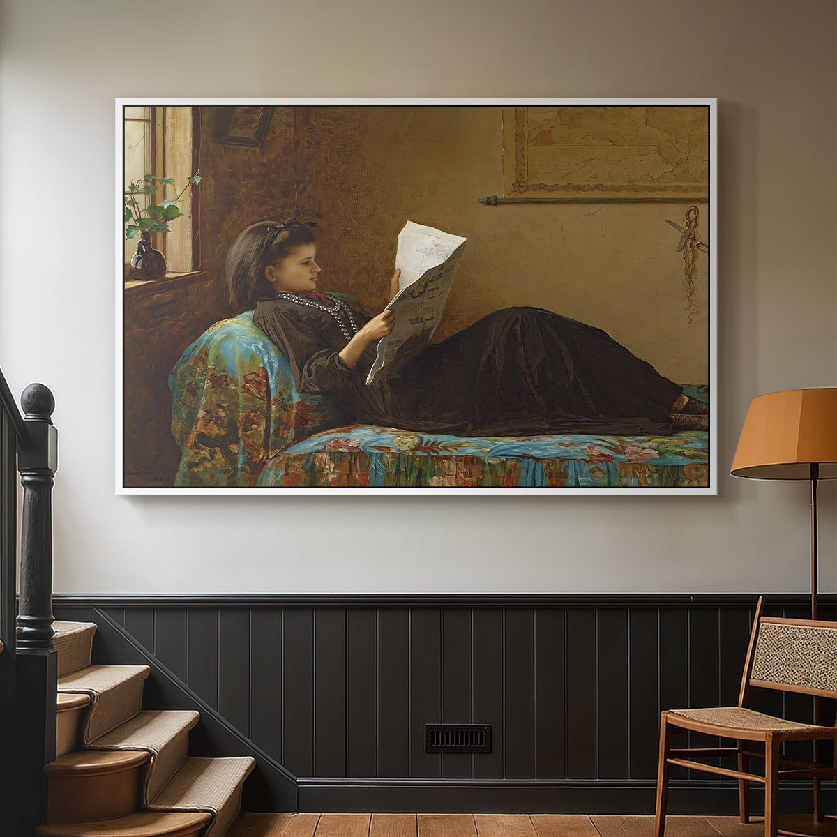 White floater framed canvas featuring a casual gathering around newspaper in rustic room, displayed in a hallway near a staircase.
