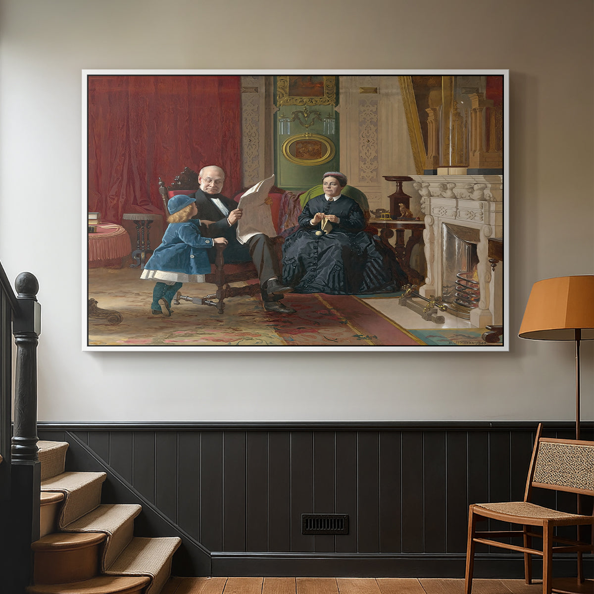 White floater framed canvas featuring a family group portrait with warm interior tones, displayed in a hallway near a staircase.