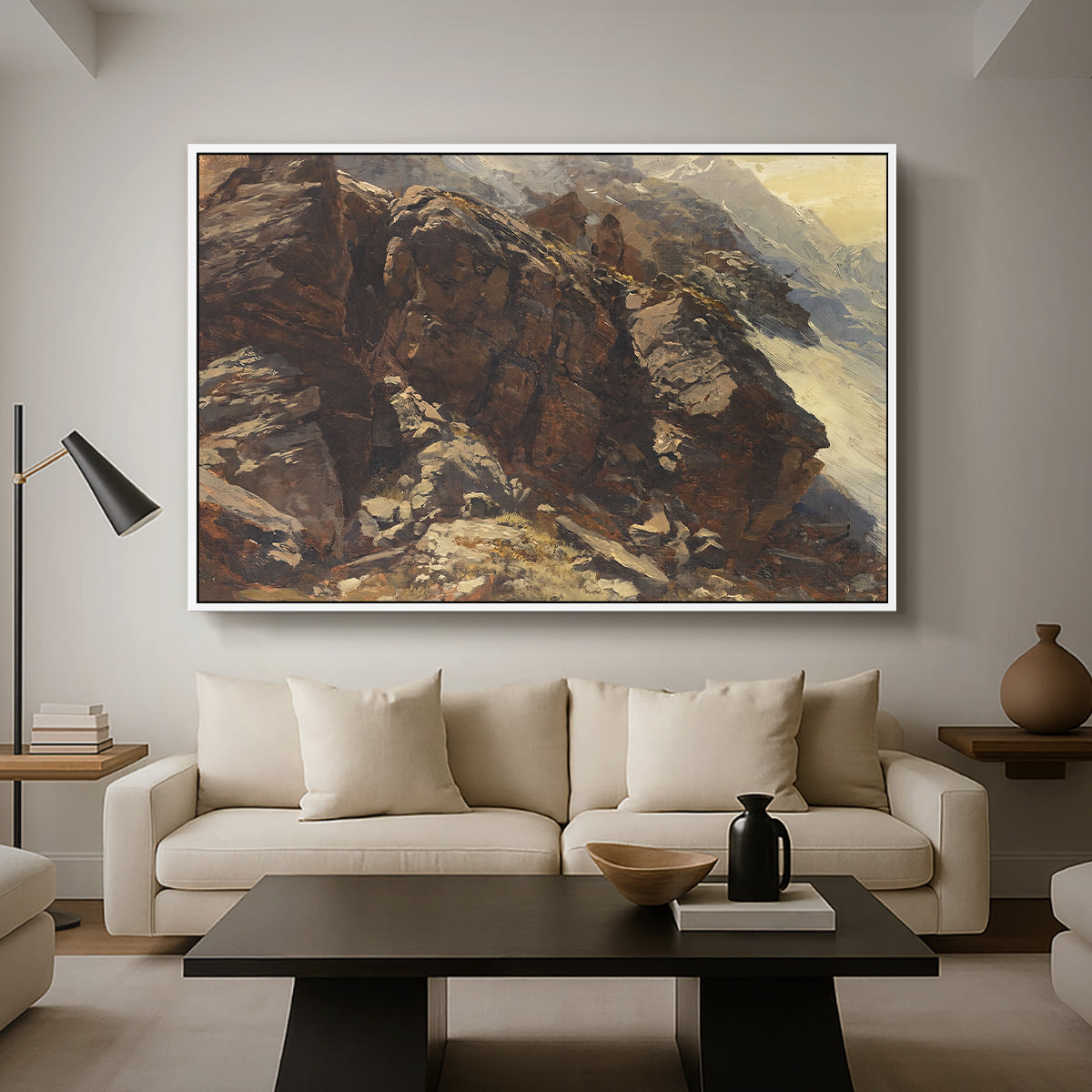 High Mountain Study, c. 1870 by Edward Theodore Compton as a white floater framed canvas featuring a rocky alpine terrain with steep slopes and distant mountain peaks, displayed above a sofa in a modern living room.