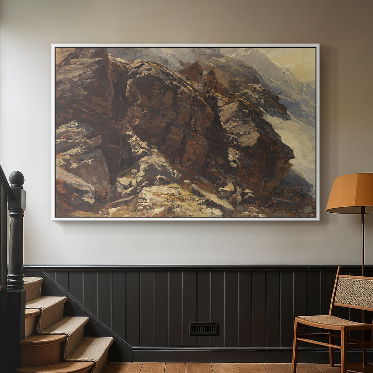 White floater framed canvas featuring a realistic depiction of mountainous terrain under open sky, displayed in a hallway near a staircase.