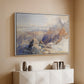 White floater framed canvas of Col du Géant, 1903 by Edward Theodore Compton, featuring a high mountain landscape featuring dramatic ridges and glacier terrain above a console cabinet in a minimalist entryway.