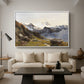 The Großglockner from the Prager Hut, 1890 by Edward Theodore Compton as a white floater framed canvas featuring a view of Großglockner peak from alpine hut overlooking valley, displayed above a sofa in a modern living room.