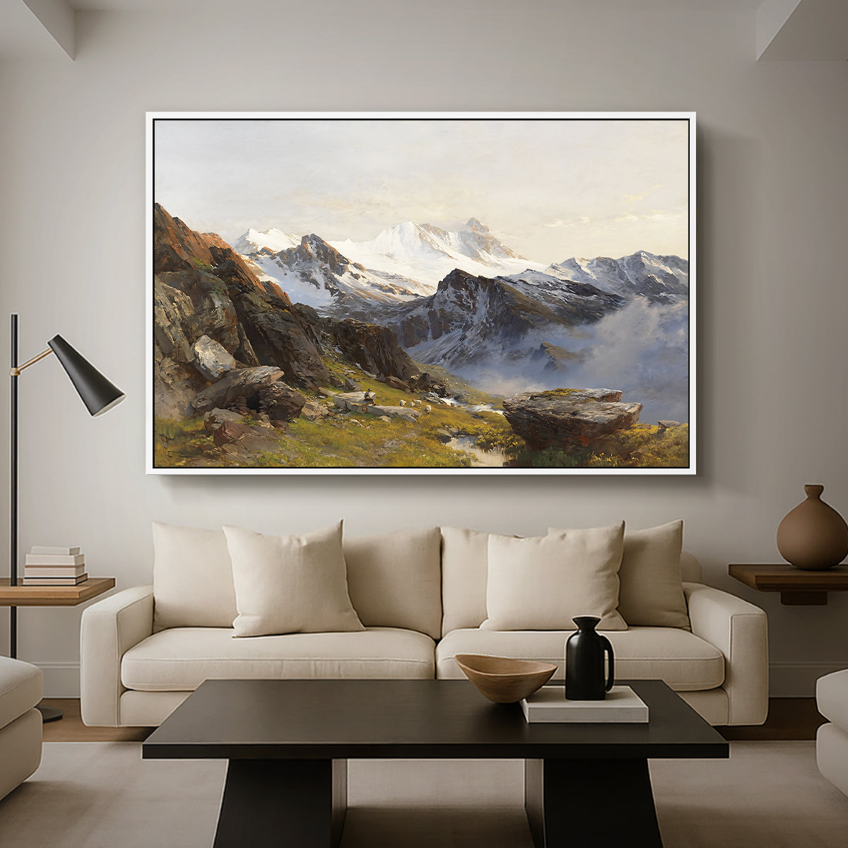 The Großglockner from the Prager Hut, 1890 by Edward Theodore Compton as a white floater framed canvas featuring a view of Großglockner peak from alpine hut overlooking valley, displayed above a sofa in a modern living room.