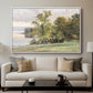 Landscape at Lake Starnberg, 1890 by Edward Theodore Compton displayed in a white floater framed canvas above a sofa in a clean living room.