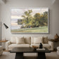 Landscape at Lake Starnberg, 1890 by Edward Theodore Compton as a white floater framed canvas featuring a lakeside landscape with calm water and trees along shoreline, displayed above a sofa in a modern living room.