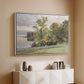 White floater framed canvas of Landscape at Lake Starnberg, 1890 by Edward Theodore Compton, featuring a peaceful lake scene with reflections and surrounding greenery above a console cabinet in a minimalist entryway.