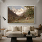 Landscape in the Caucasus, c. 1921 by Edward Theodore Compton as a white floater framed canvas featuring a mountainous landscape with rugged terrain and distant peaks, displayed above a sofa in a modern living room.