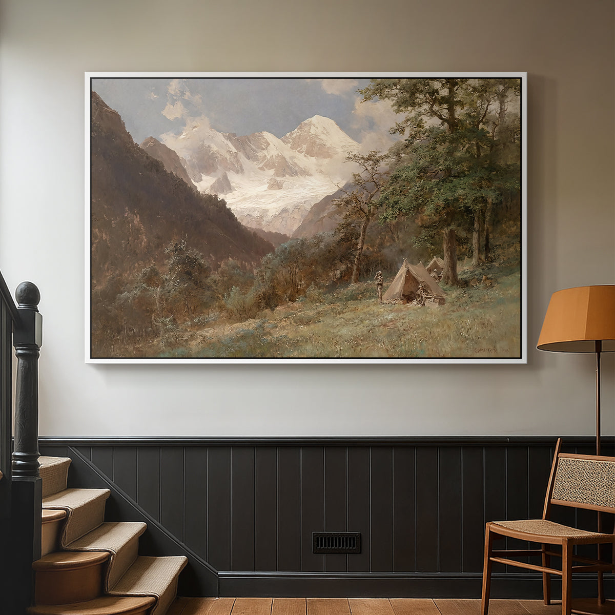 White floater framed canvas featuring a realistic depiction of remote mountain environment, displayed in a hallway near a staircase.