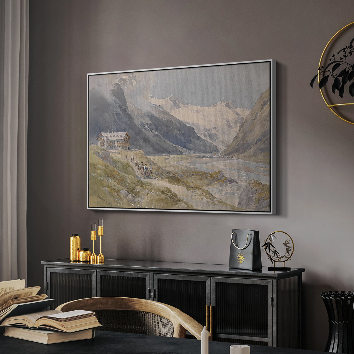 Shepherds (Pasterze), c. 1921 by Edward Theodore Compton in a white floater framed canvas featuring a rural alpine setting with shepherds and open terrain, displayed above a desk in a dark home office interior.
