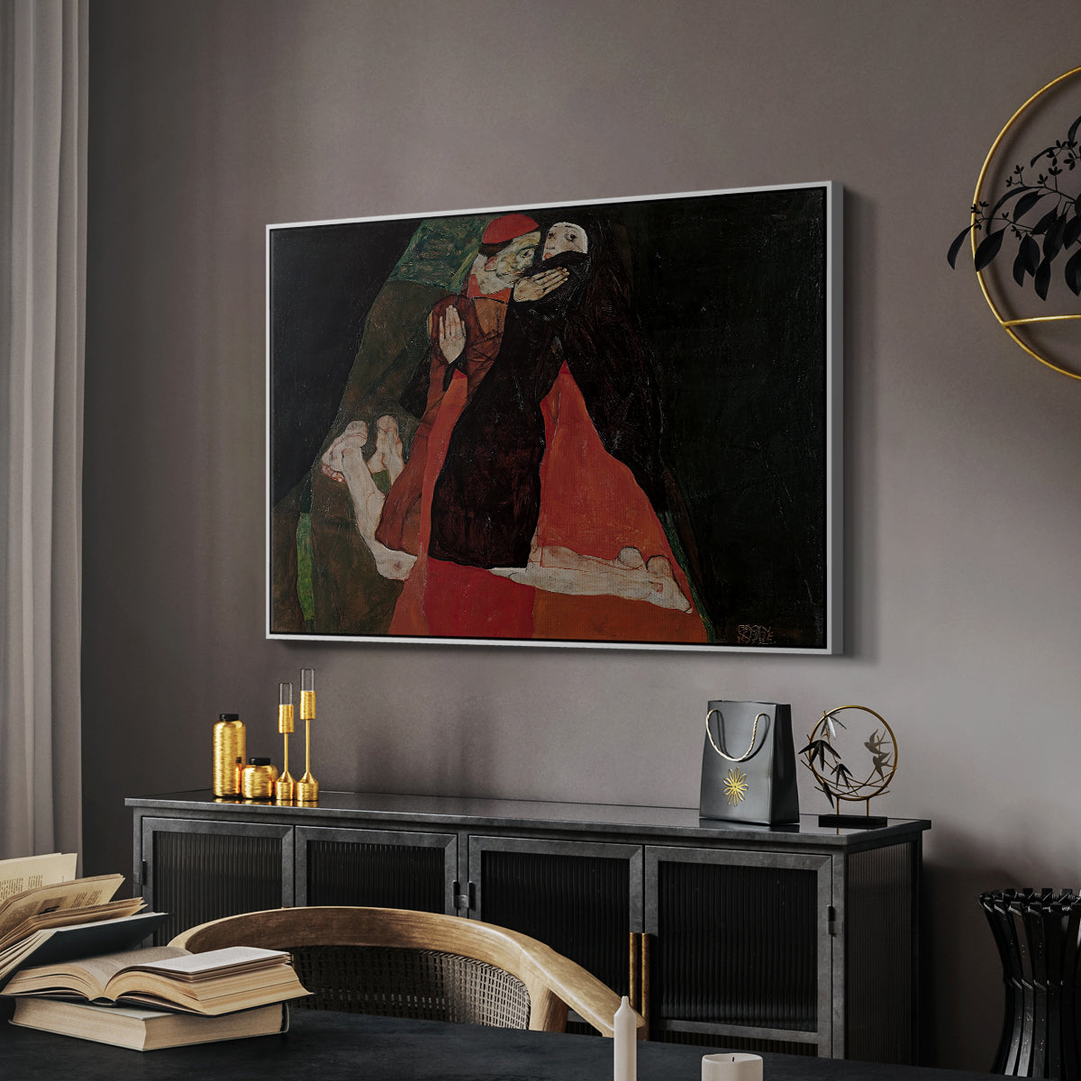 Cardinal and Nun (Caress), 1912 by Egon Schiele in a white floater framed canvas featuring an expressive painting of figures entwined with bold lines and color, displayed above a desk in a dark home office interior.
