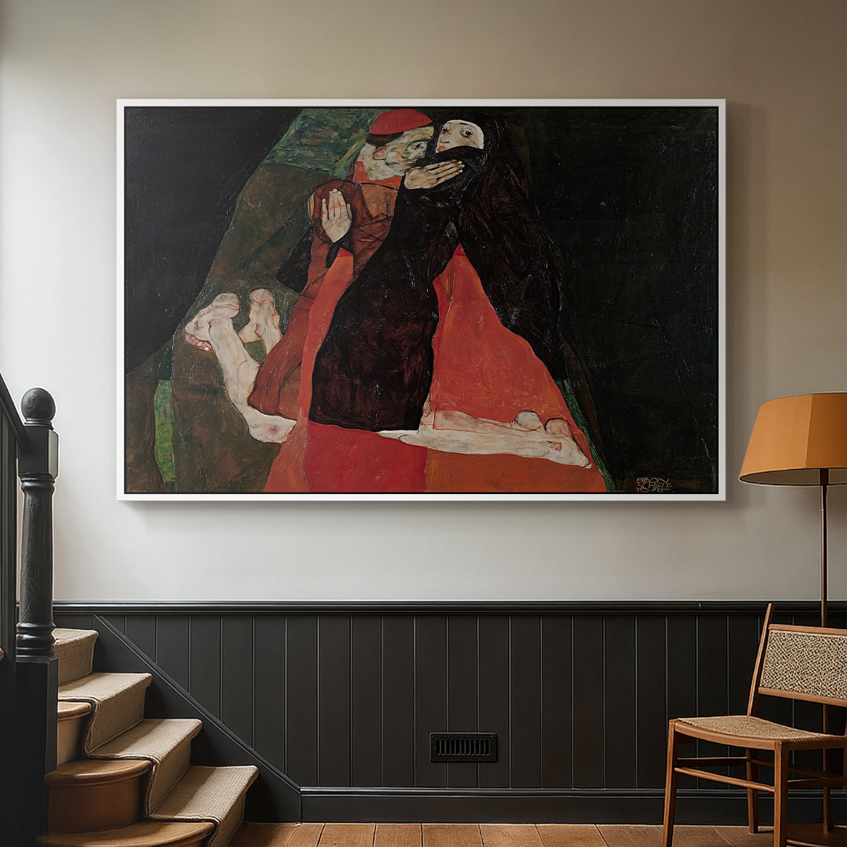 White floater framed canvas featuring an intimate scene with religious figures in modernist style, displayed in a hallway near a staircase.