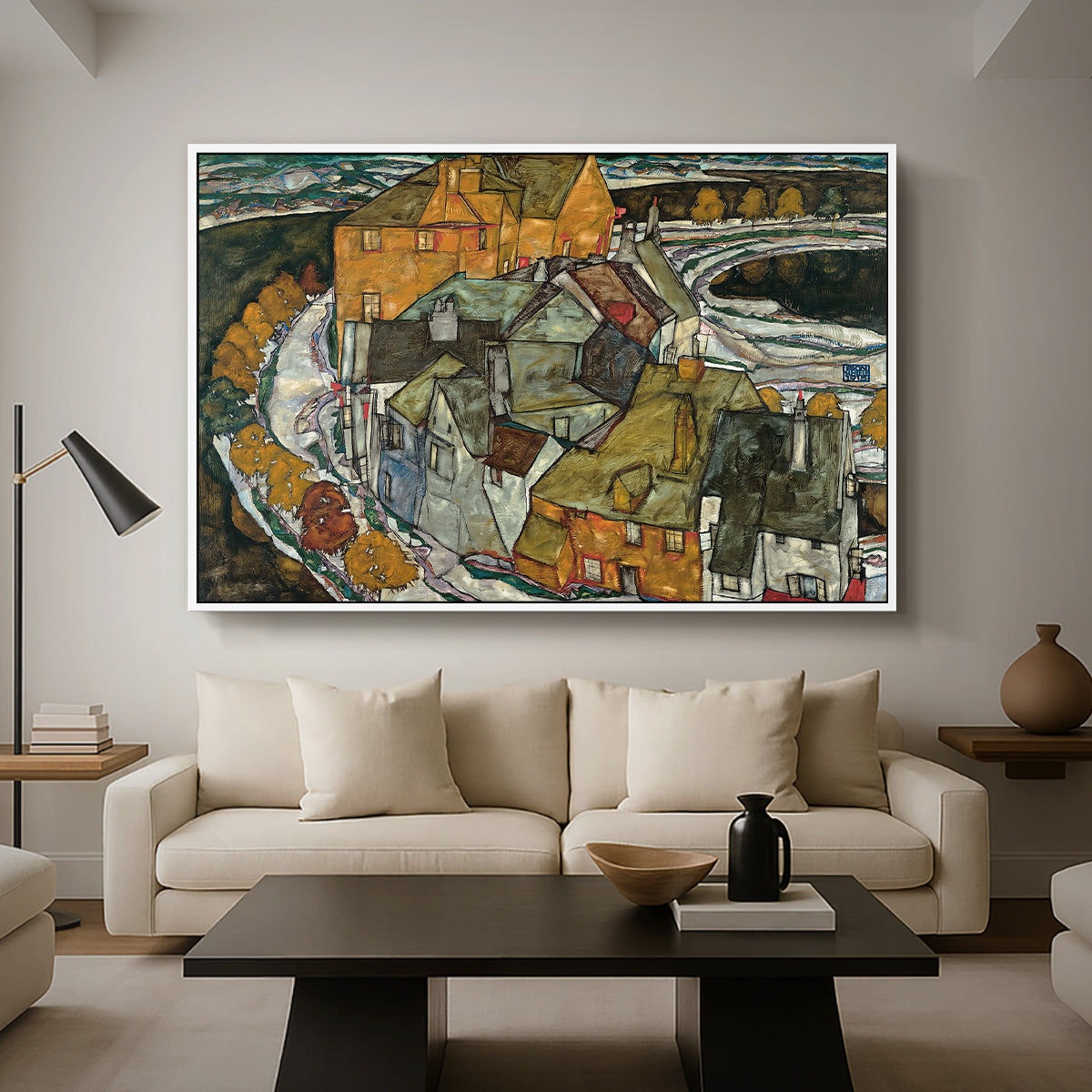 Crescent of Houses II (Island Town), 1915 by Egon Schiele as a white floater framed canvas featuring a curved row of colorful houses forming crescent shape along water, displayed above a sofa in a modern living room.