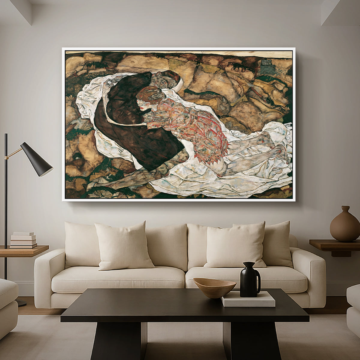 Death and the Maiden, 1915 by Egon Schiele as a white floater framed canvas featuring intertwined figures representing death and woman in emotional embrace, displayed above a sofa in a modern living room.