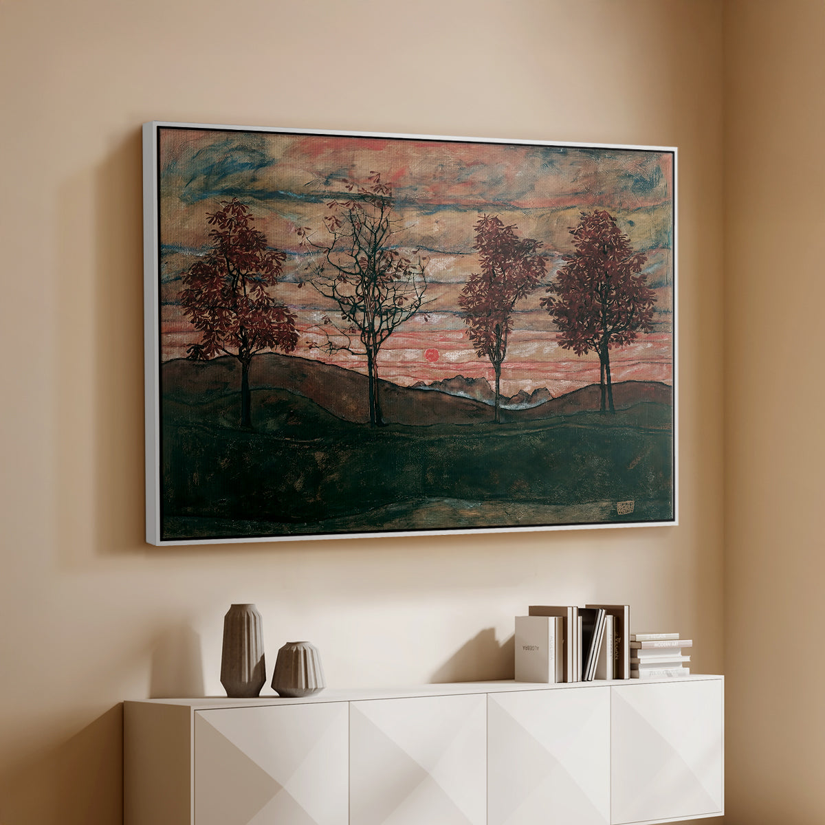 White floater framed canvas of Four Trees, 1917 by Egon Schiele, featuring a minimal landscape with grouped trees and expressive color above a console cabinet in a minimalist entryway.