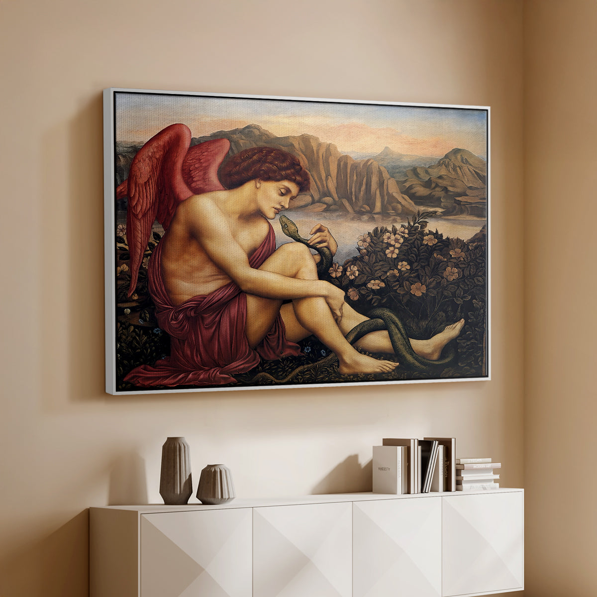 White floater framed canvas of The Angel with the Serpent, c. 1870-1875 by Evelyn De Morgan, featuring a winged figure standing over serpent in allegorical composition above a console cabinet in a minimalist entryway.