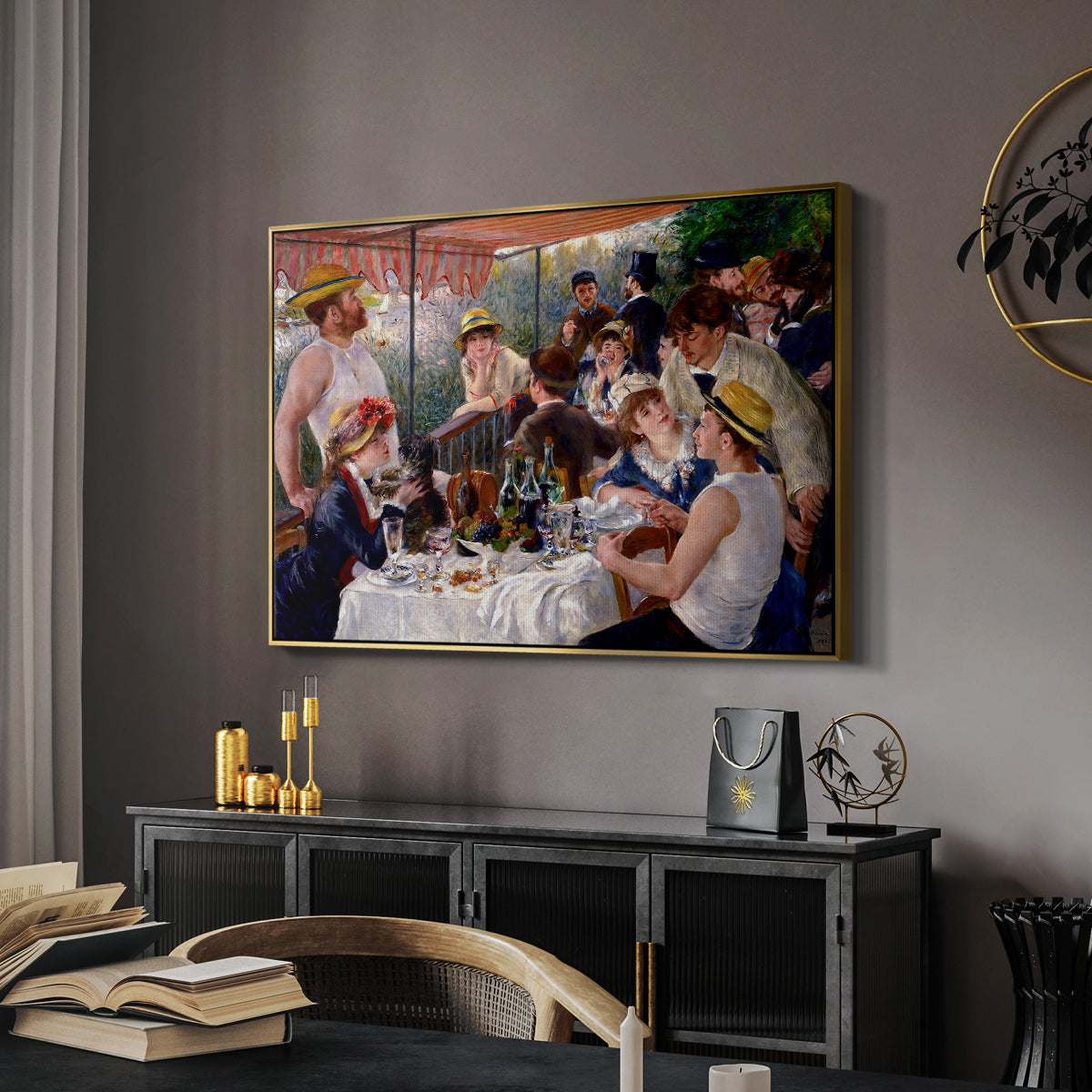 Luncheon of the Boating Party (Le Déjeuner des canotiers), 1880-1881 by Pierre-Auguste Renoir in a gold floater framed canvas featuring an impressionist scene of friends enjoying lunch with wine and conversation, displayed above a desk in a dark home office interior.
